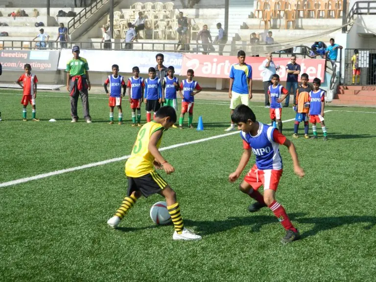Young players in bibs during a training game.